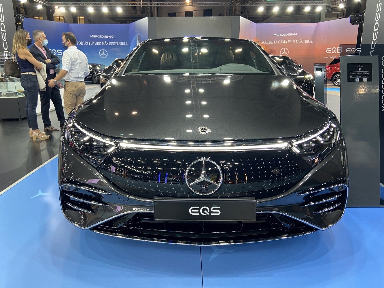Front view with LED headlights and unique grille on luxury electric sedan