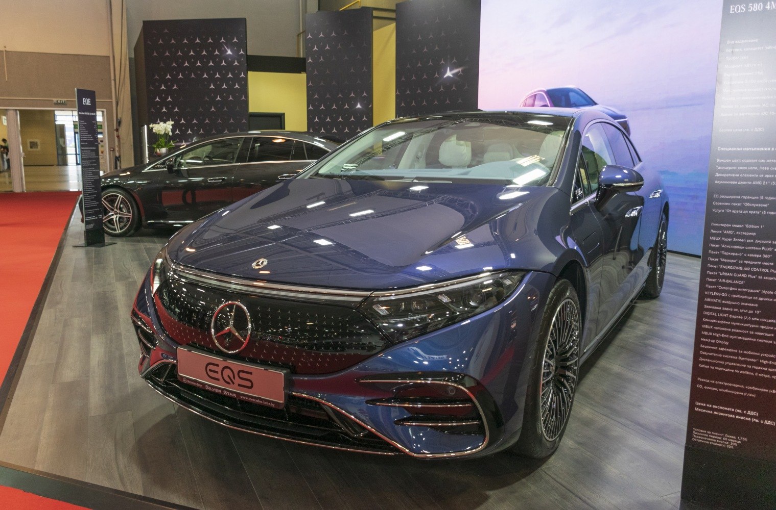 Luxury electric sedan front with LED headlights and detailed grille