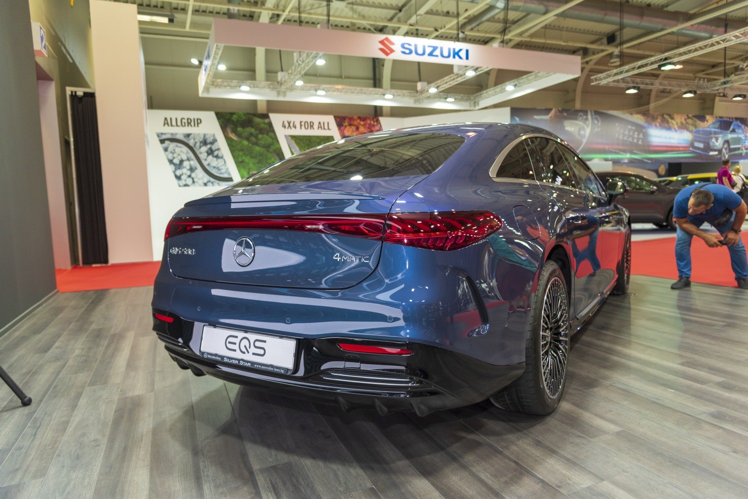 Rear view of luxury electric sedan with 4MATIC badge and modern taillights