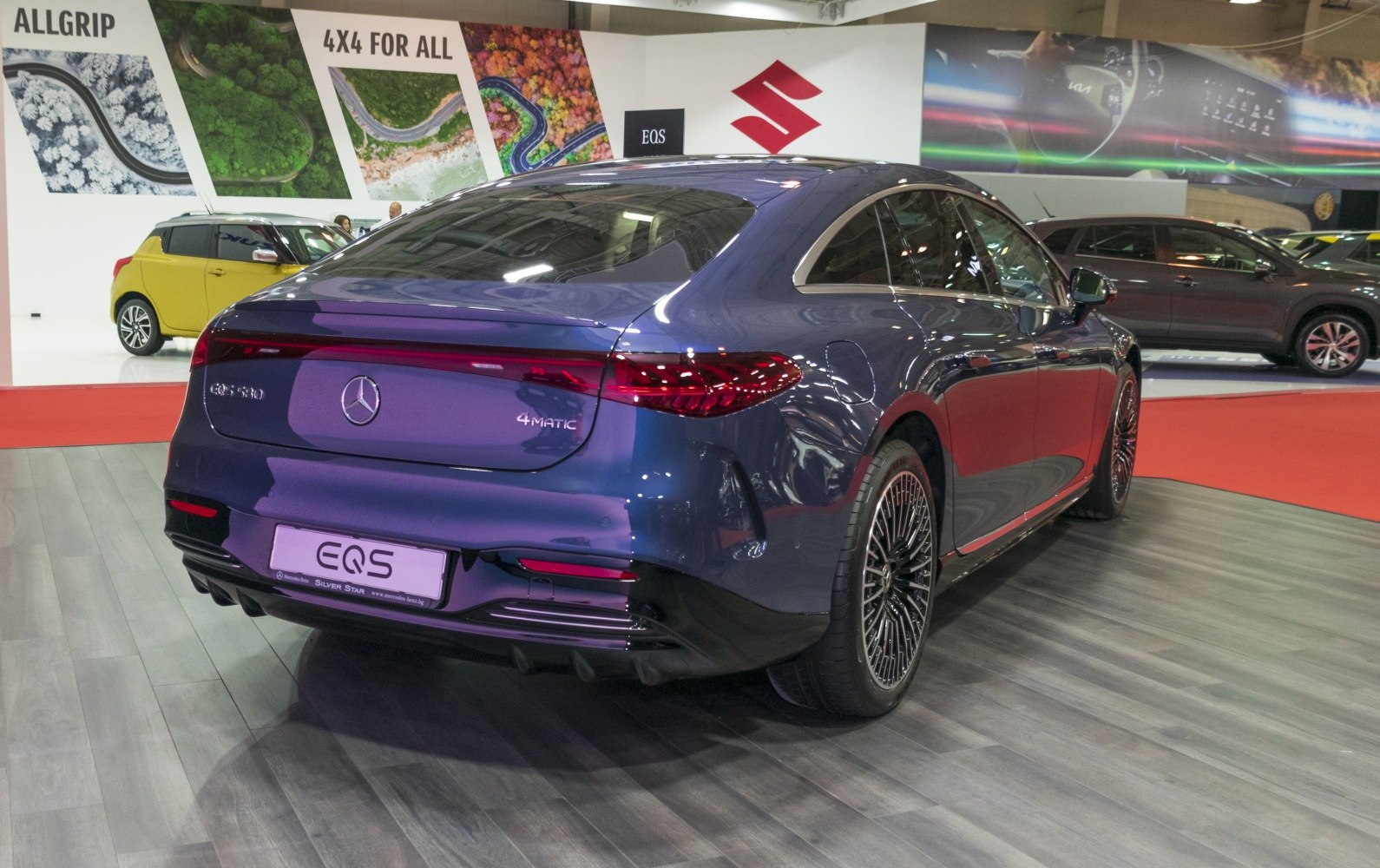 Rear and side view showcasing sleek taillights and aerodynamic design.