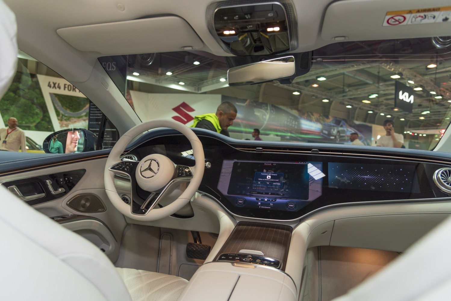 Digital dashboard with touchscreen and premium steering wheel in luxury electric sedan