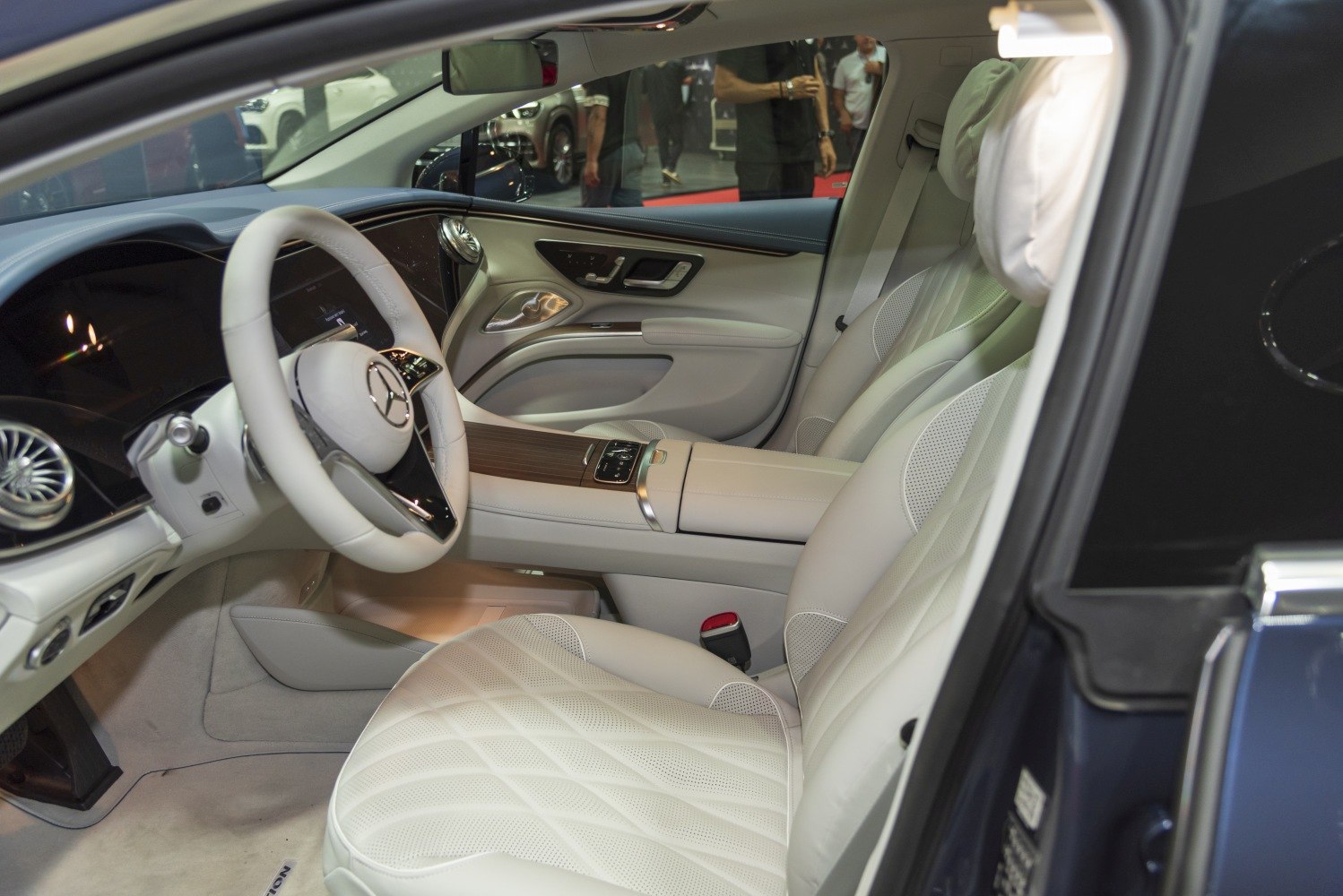 Luxurious white leather seats and futuristic dashboard with advanced controls