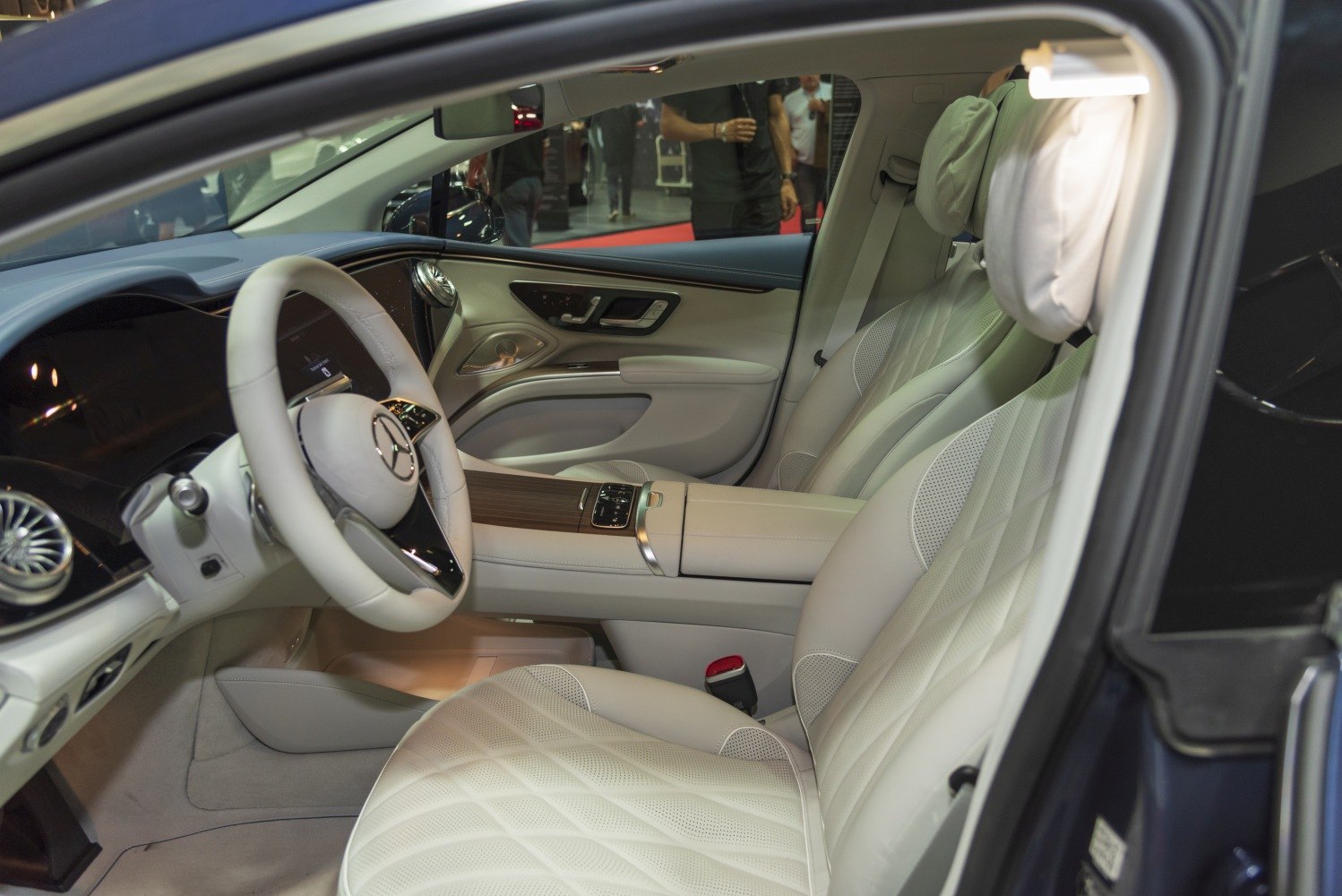 Luxurious perforated leather seats and high-tech steering wheel in premium car interior