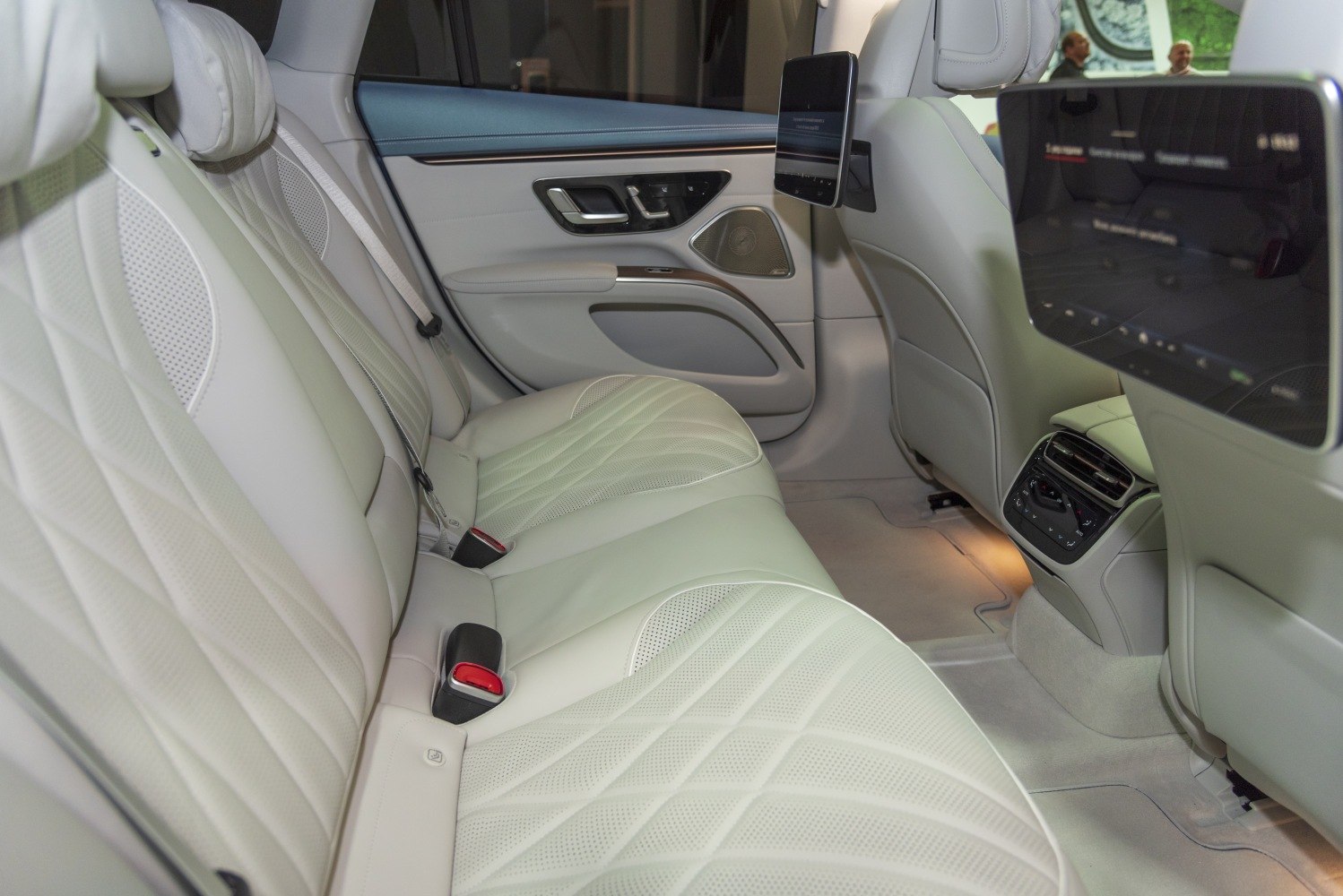 Quilted leather rear seats with dual digital screens and ambient lighting