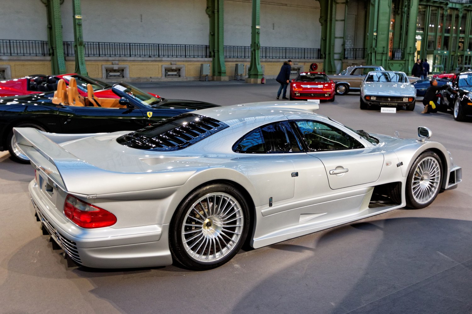 Silver silver luxury coupe with detailed aerodynamic body and alloy wheels