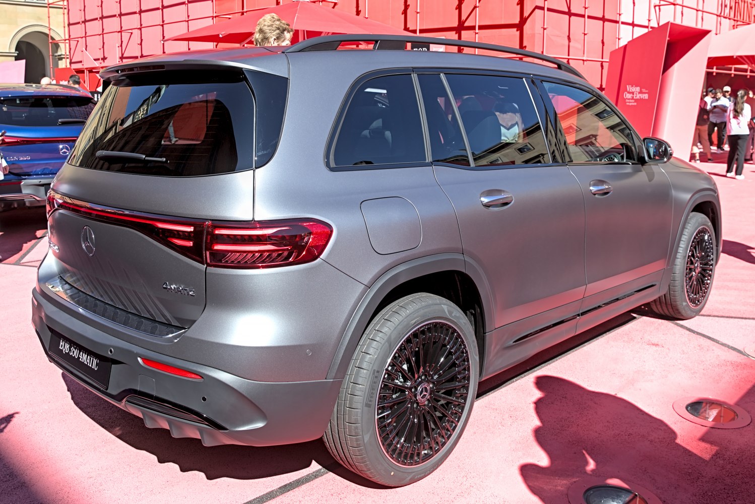Rear and side view of an SUV with black multi-spoke alloy wheels and modern taillights