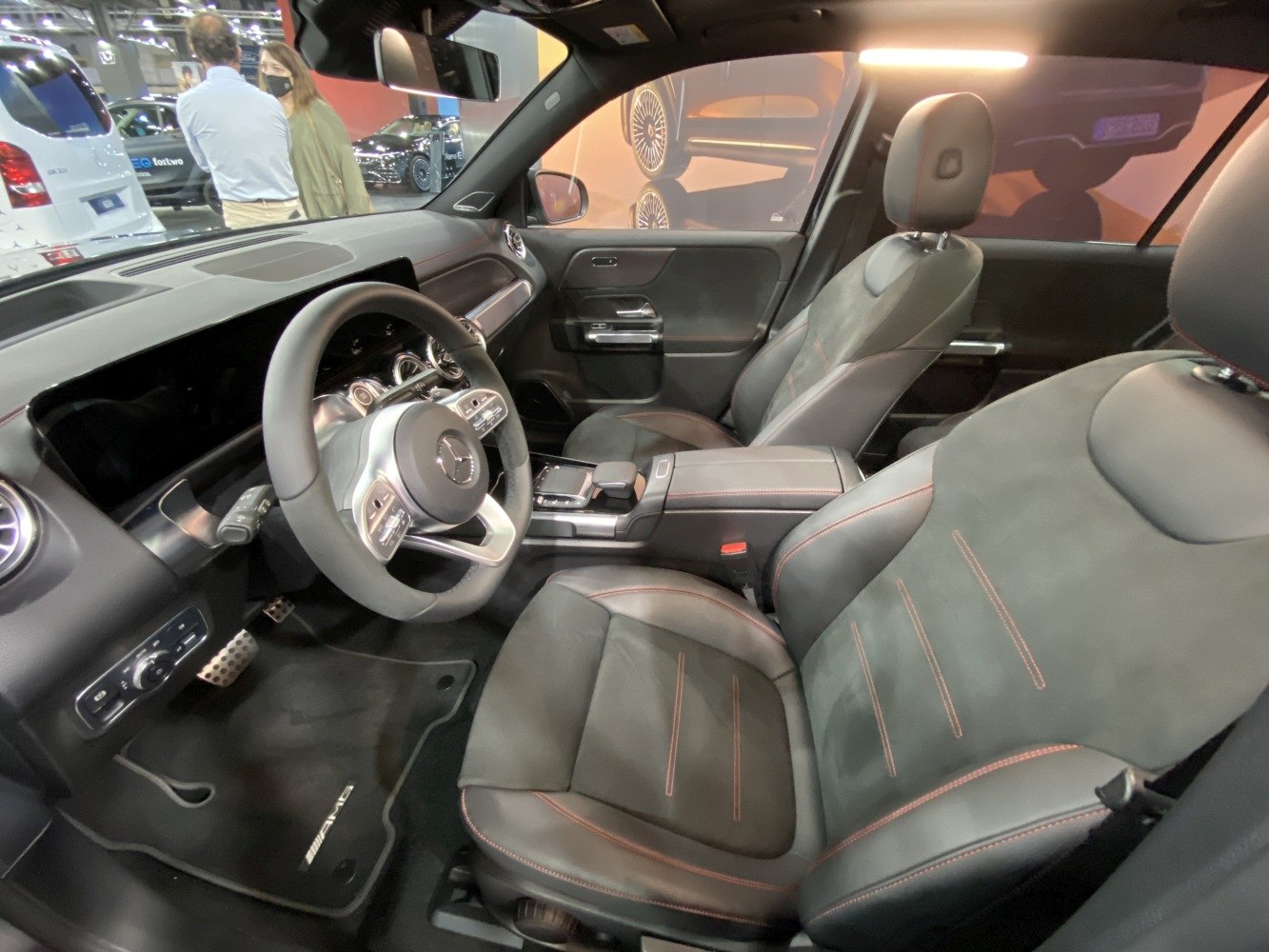 Luxury interior cabin with AMG-branded floor mats and modern dashboard