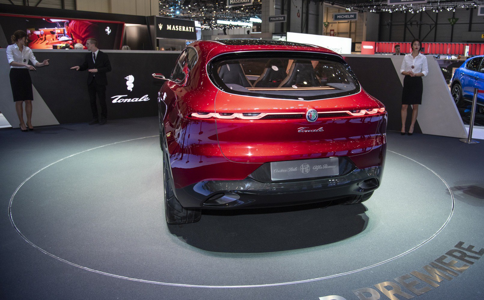 Rear view of a sleek SUV with LED taillights and a large rear window.