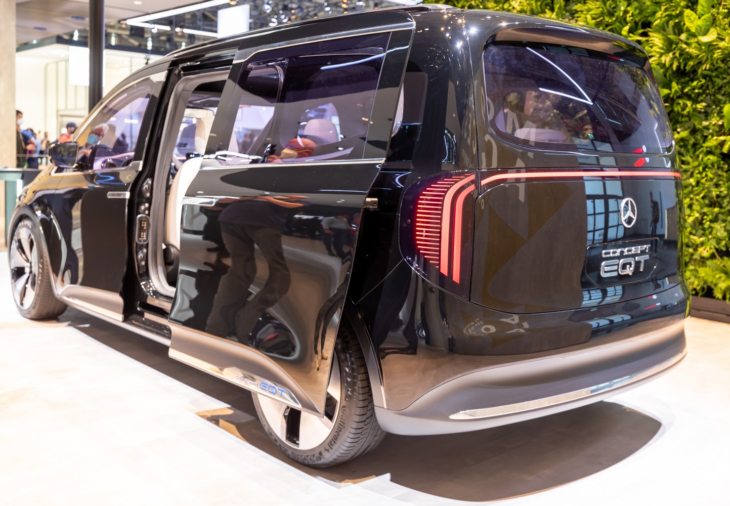 Rear view of electric MPV with sliding door and unique rear lights