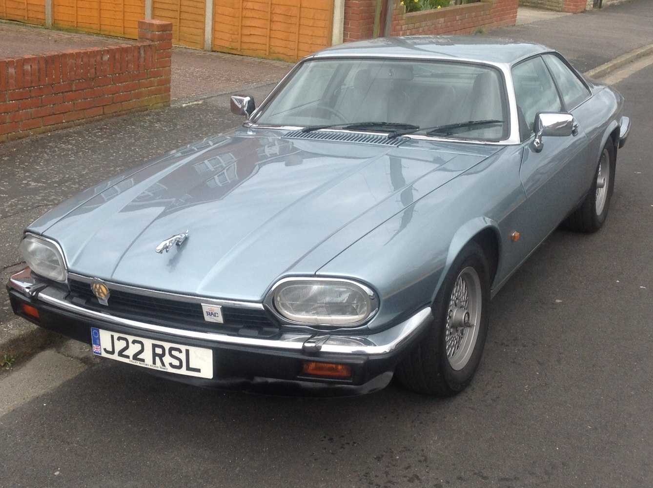 Front view of a classic coupe with dual headlights and chrome trim