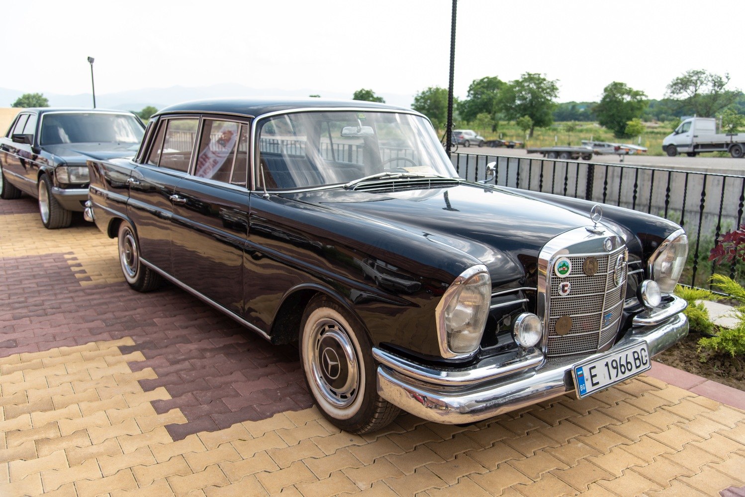 Front grille and side view of classic vintage sedan with chrome details