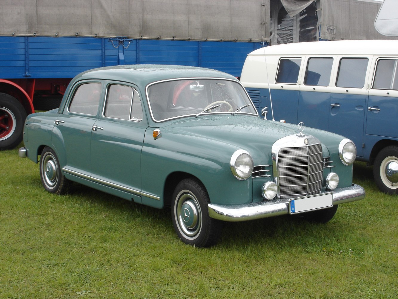 Rounded body sedan with classic chrome grille and steel wheels with chrome hubcaps.