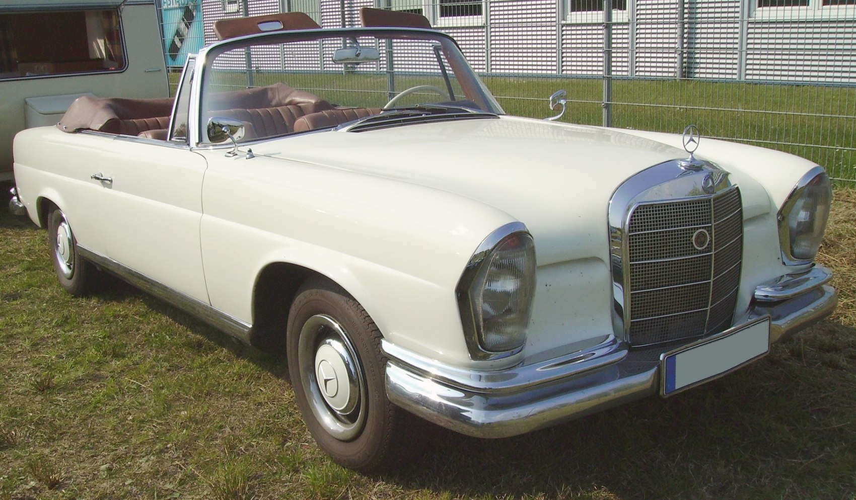Vintage convertible with chrome grille and classic design