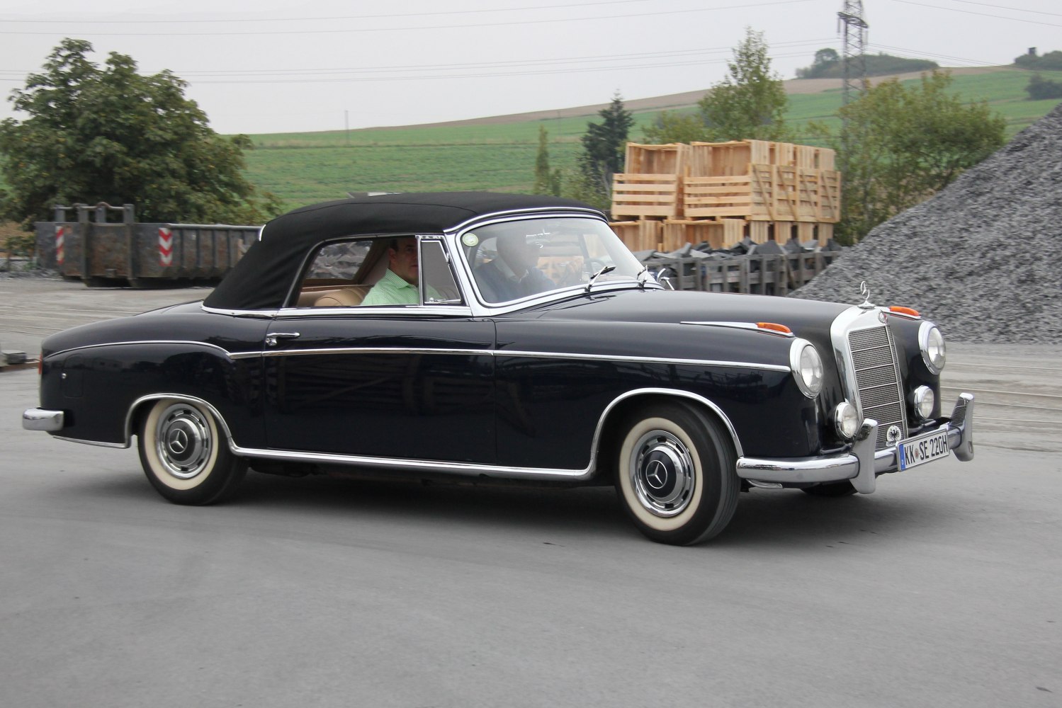 Black vintage convertible with elegant chrome trim and classic design.