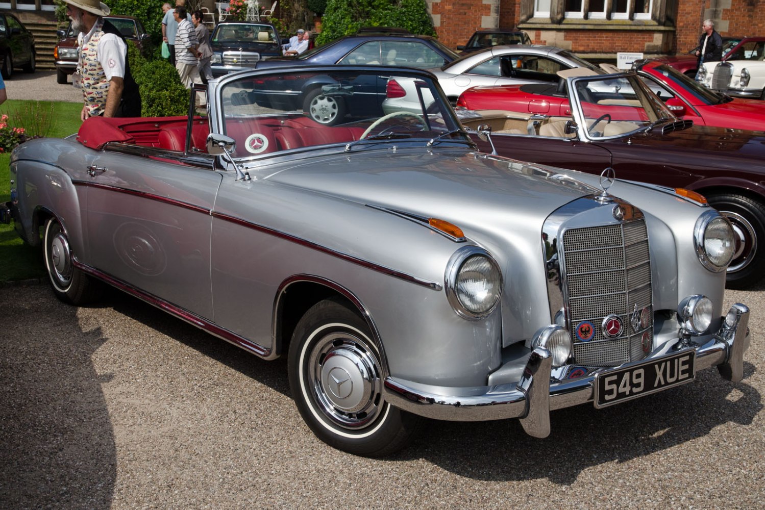 Vintage convertible with chrome grille and round headlights