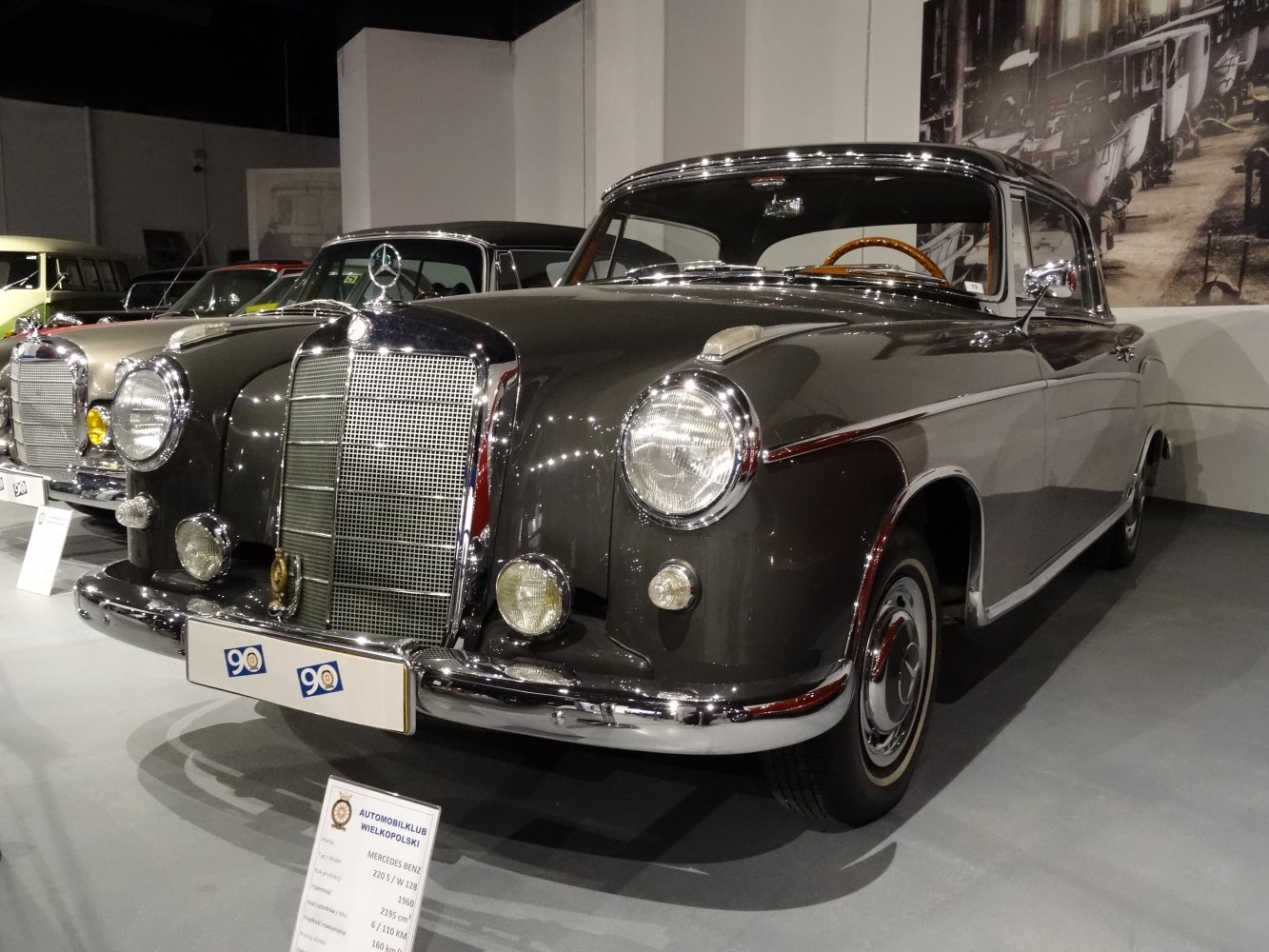 Classic vintage coupe front with round headlights and chrome grille
