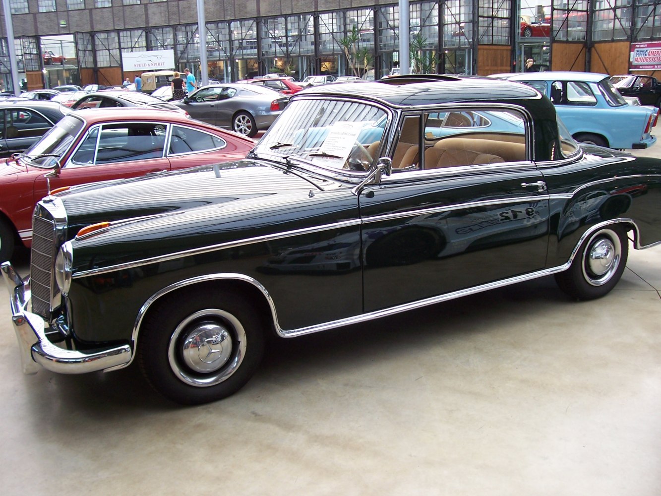 1950s two-door luxury coupe with chrome trim