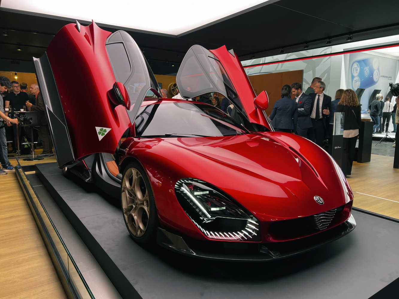 Red sports car with butterfly doors and LED headlights