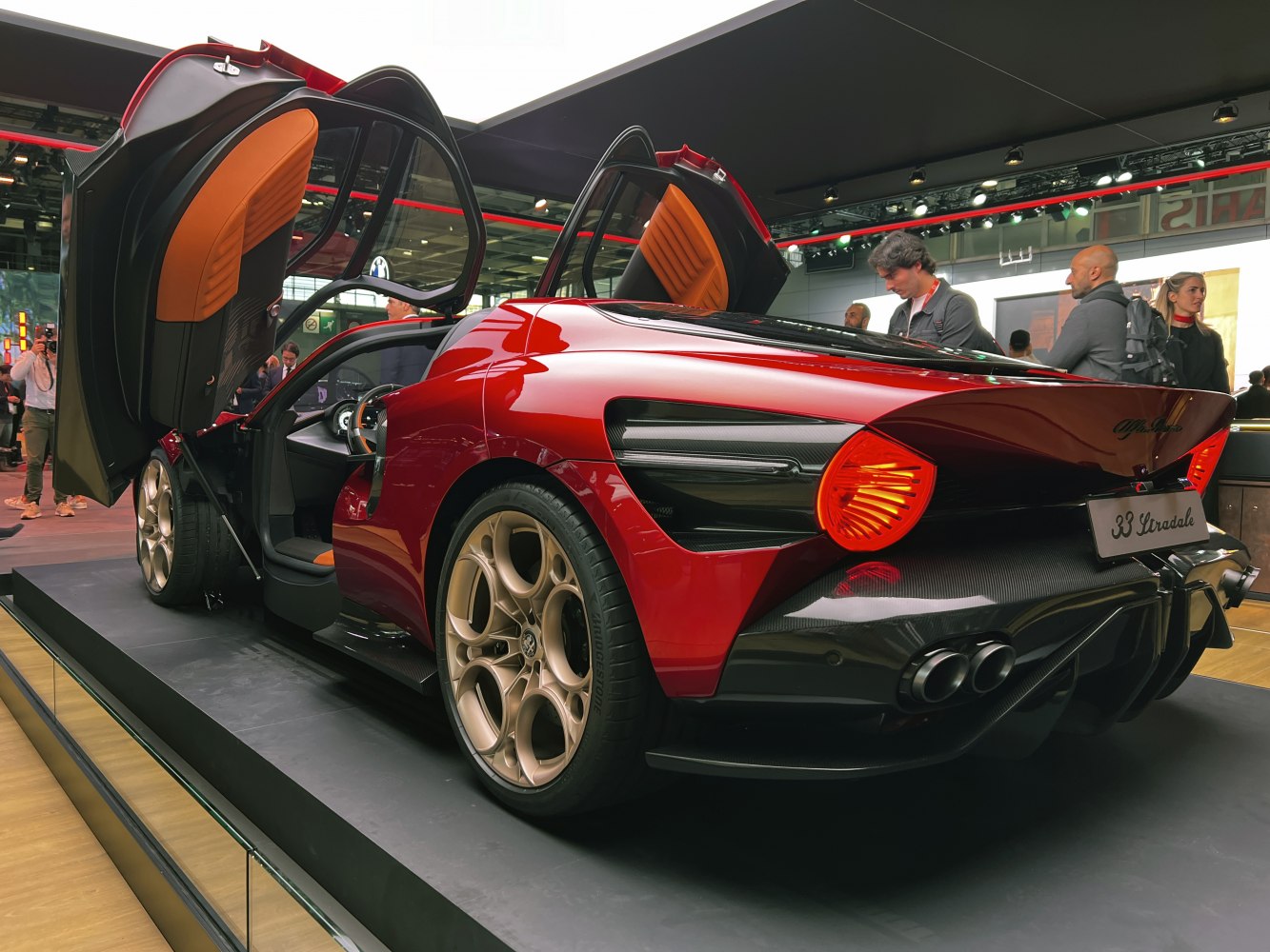 Butterfly doors and rear view with quad exhausts and round taillights
