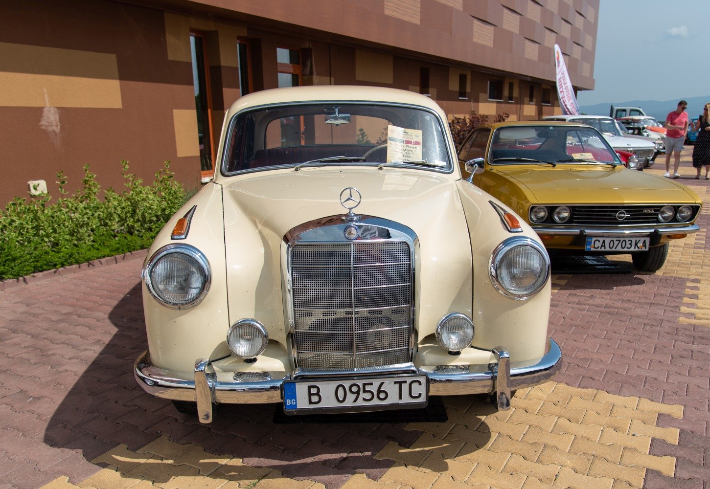 Front view with prominent chrome grille and round headlights.