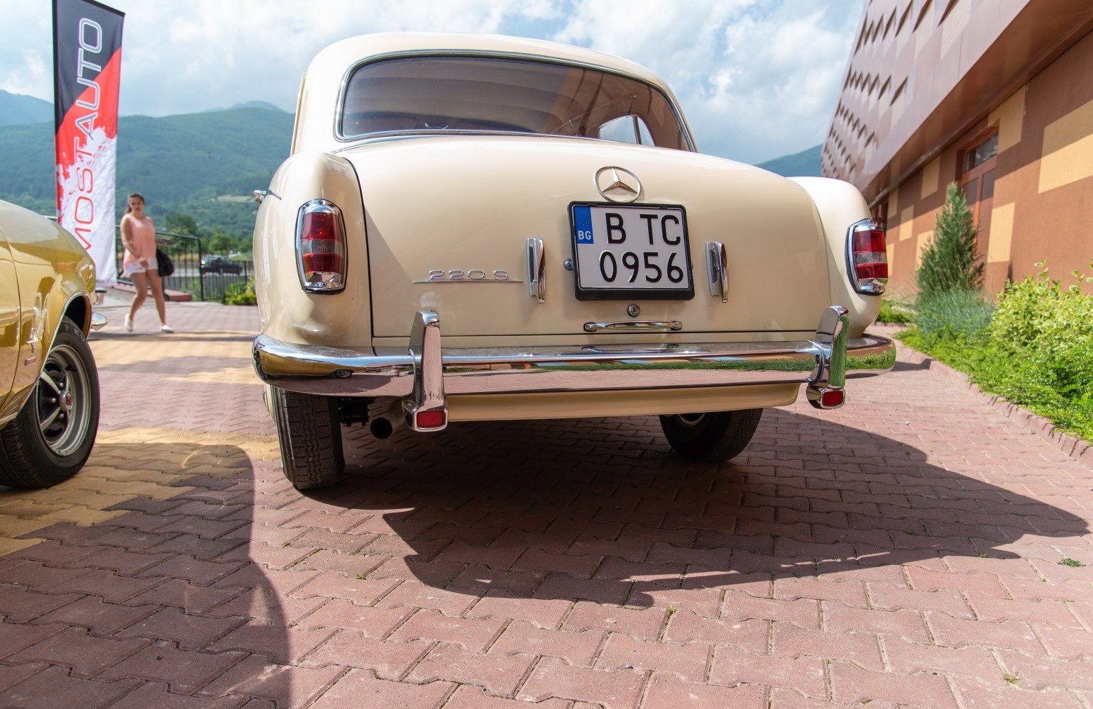 Rear view with chrome bumper and classic rounded taillights.