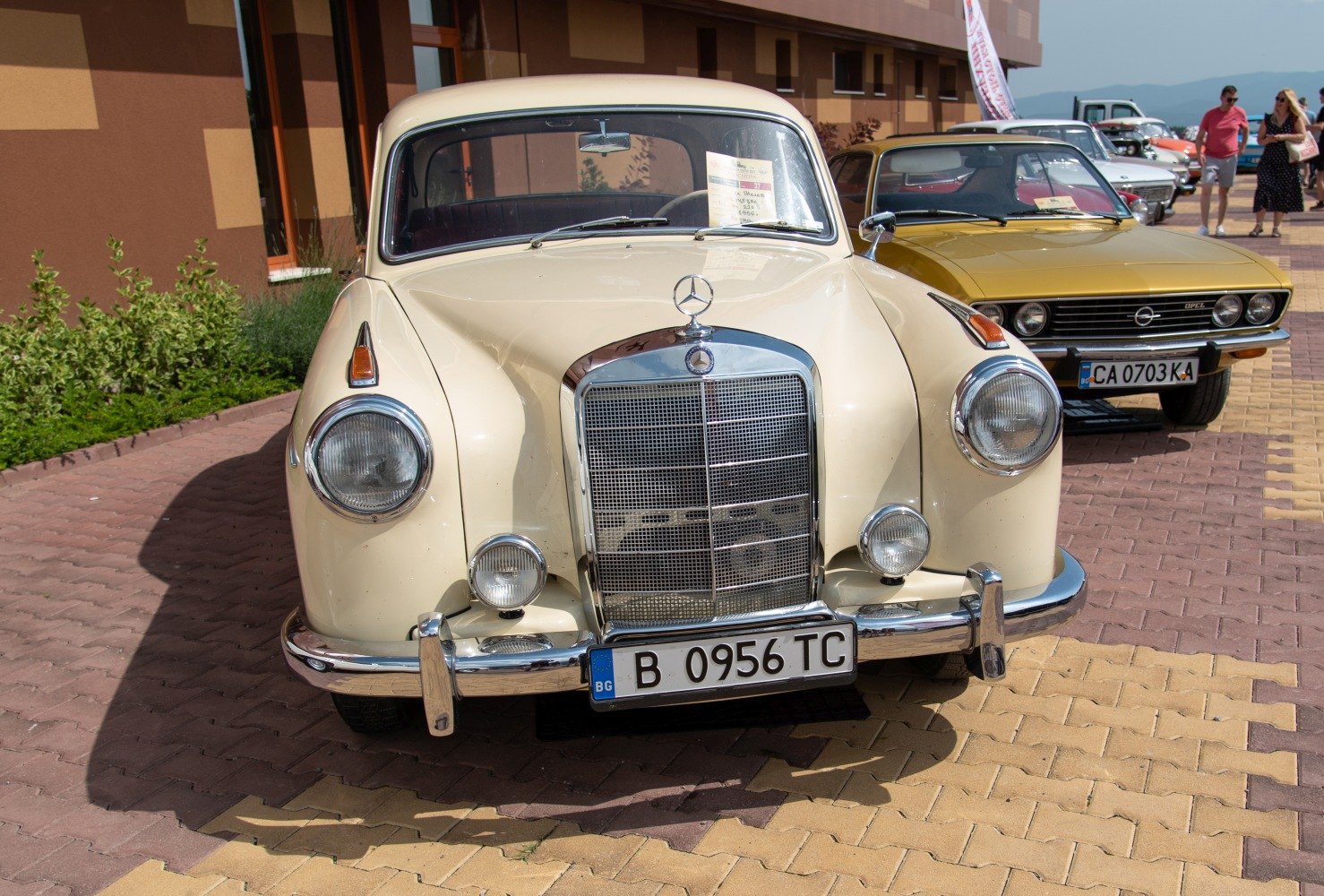Front view of vintage car with classic grille and round headlights