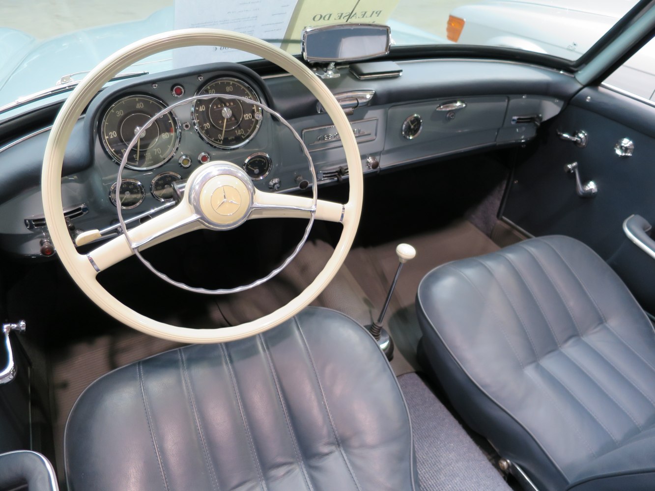 Vintage steering wheel and detailed dashboard with leather seats