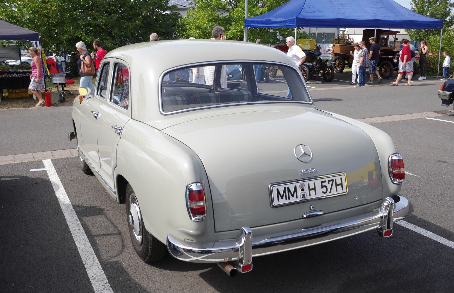 Rear view of vintage sedan with curved window and chrome bumper