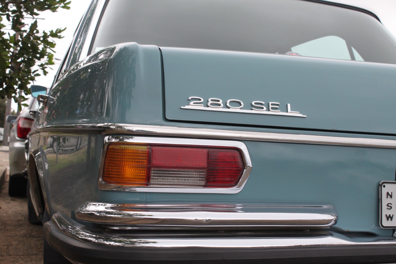 Rear close-up of 1970s luxury sedan with 280 SEL badge and classic taillight.
