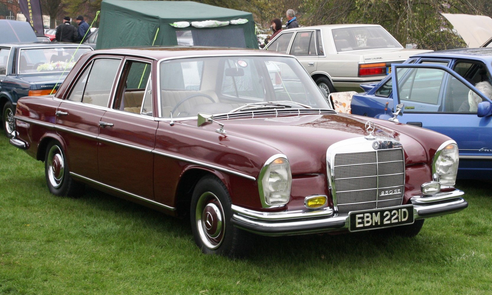 Classic sedan with chrome grille and maroon paint, vintage design