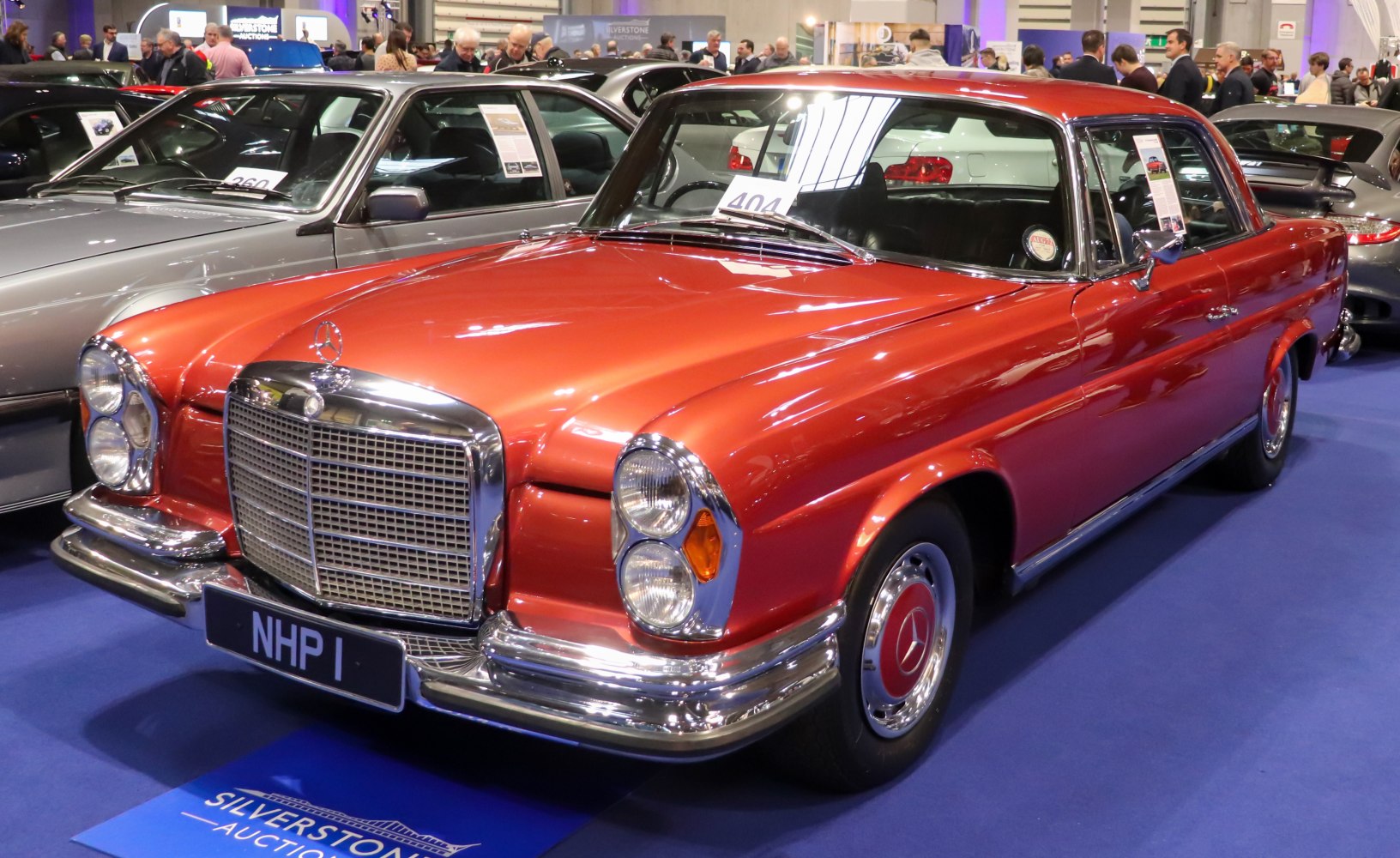 Vintage luxury sedan with dual round headlights and chrome grille