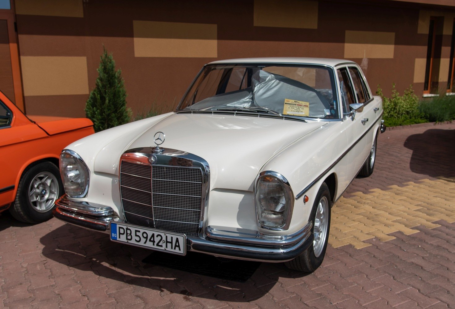 Classic front grille and headlights of a vintage luxury sedan