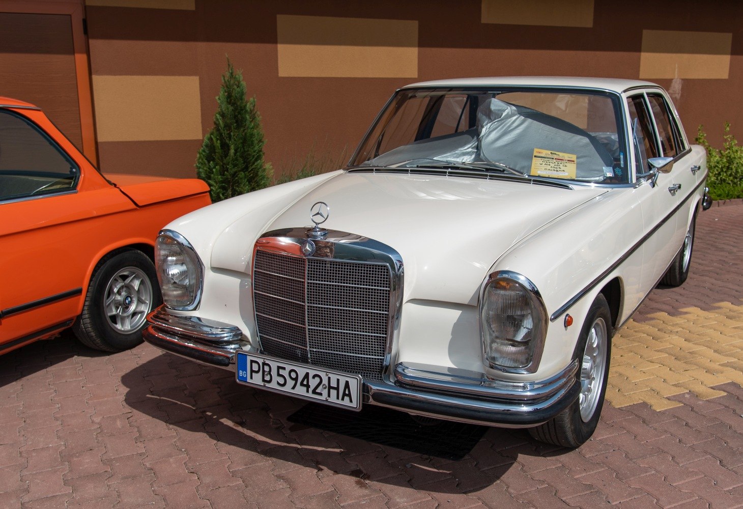 Front view with chrome grille and rounded headlights