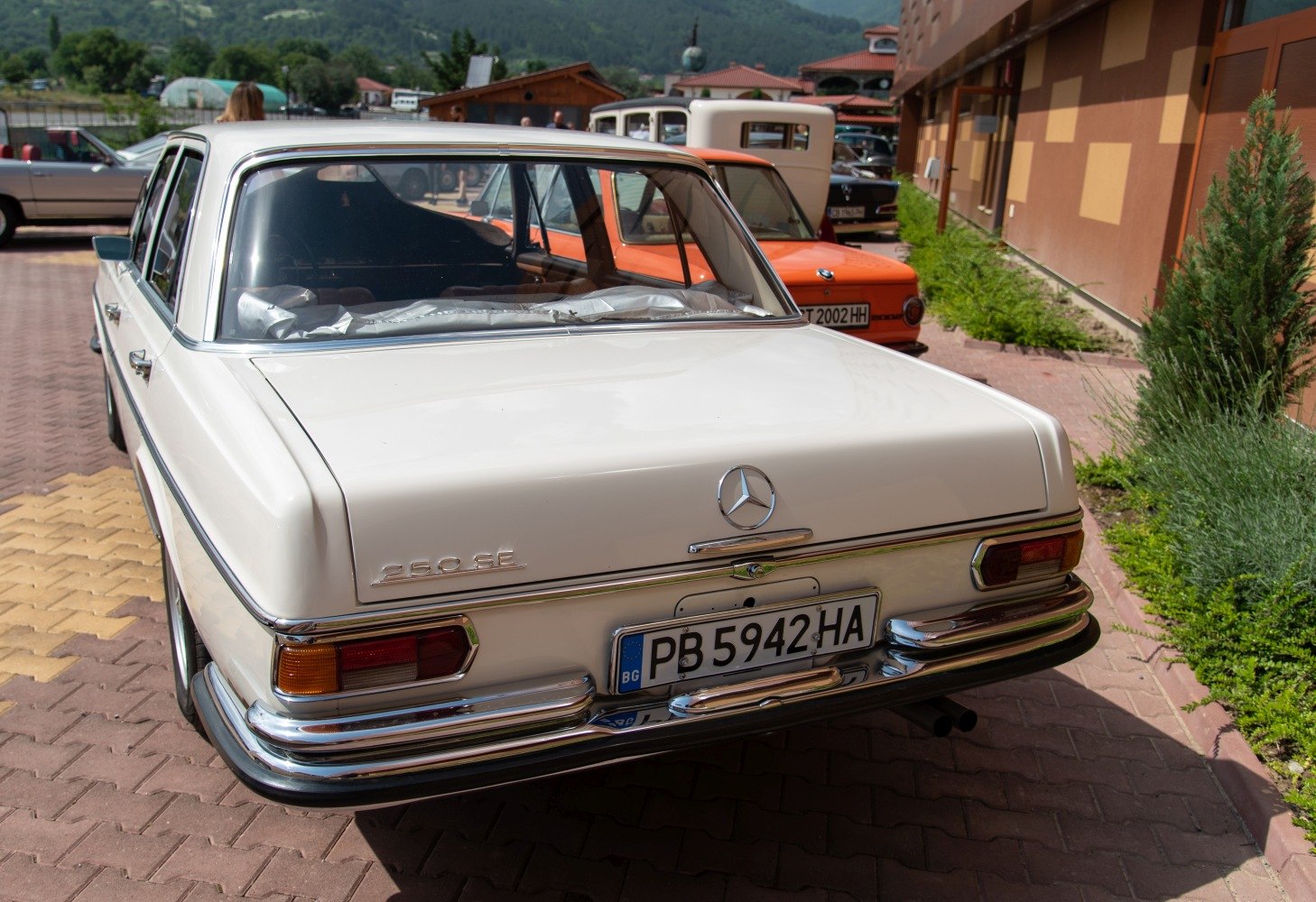 Rear view of a classic 1960s sedan with chrome bumpers and distinctive taillights