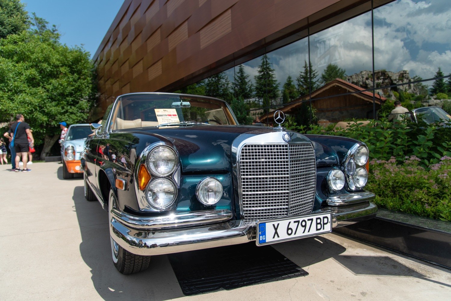 Front grille and quad round headlights of a vintage convertible