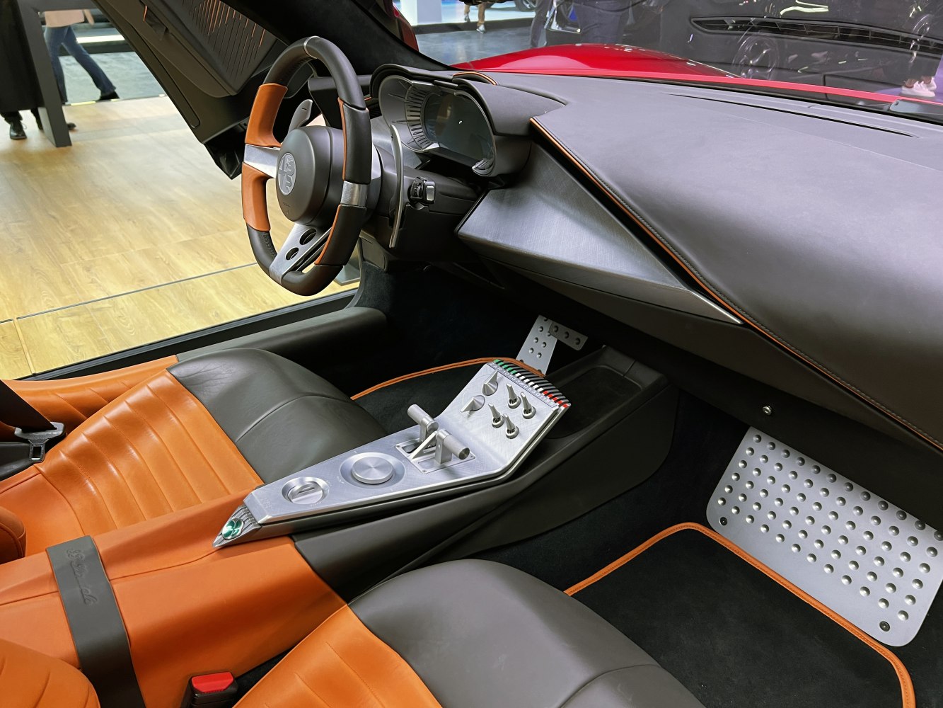 Modern cockpit with unique aluminum center console and leather seats.