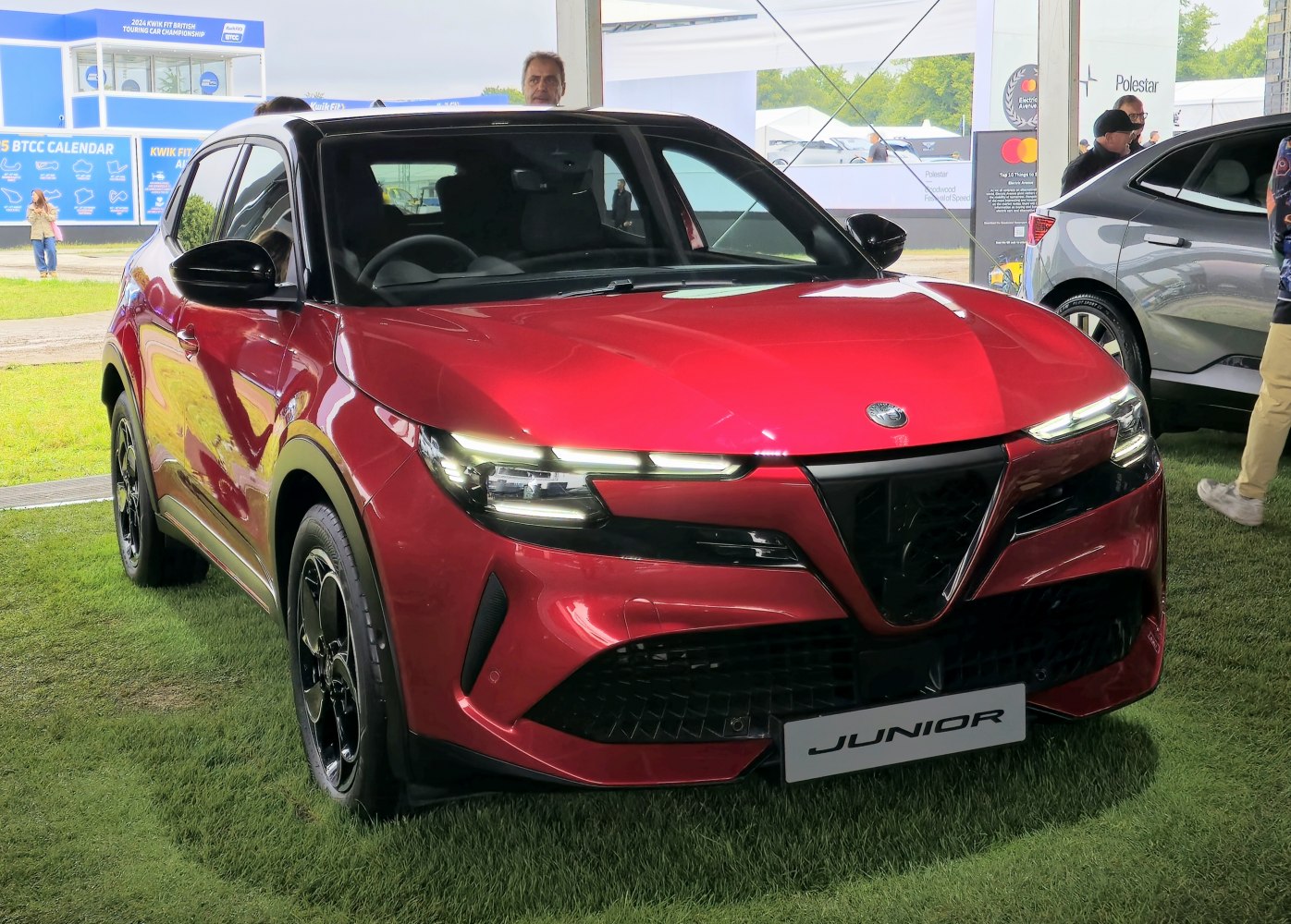 Sleek front view with LED headlights and prominent grille