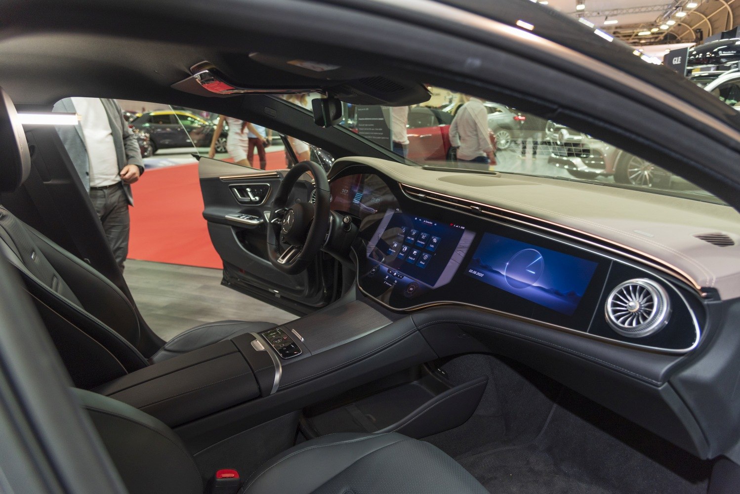 Luxurious car dashboard with wide digital display and modern control panel