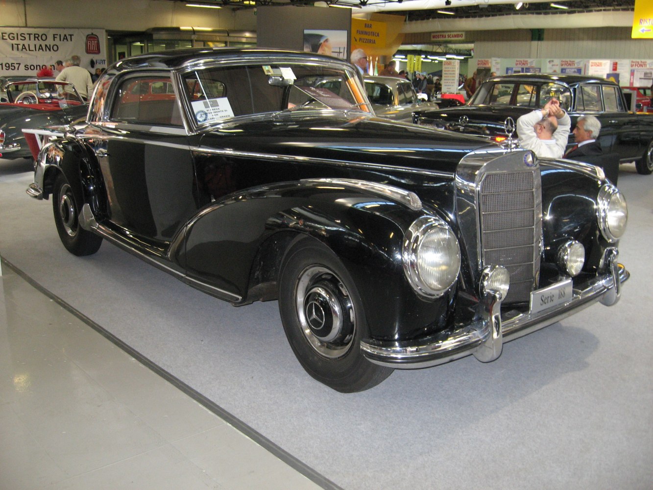 Vintage luxury coupe with distinctive front grille and round headlights