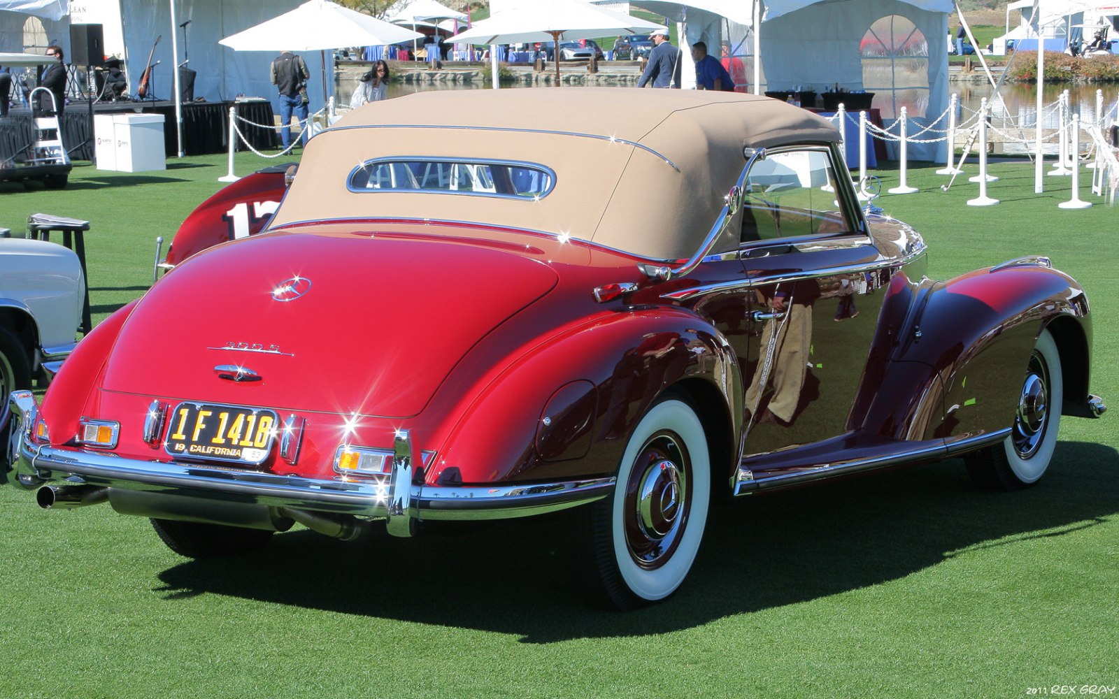 Convertible with beige soft top and whitewall tires