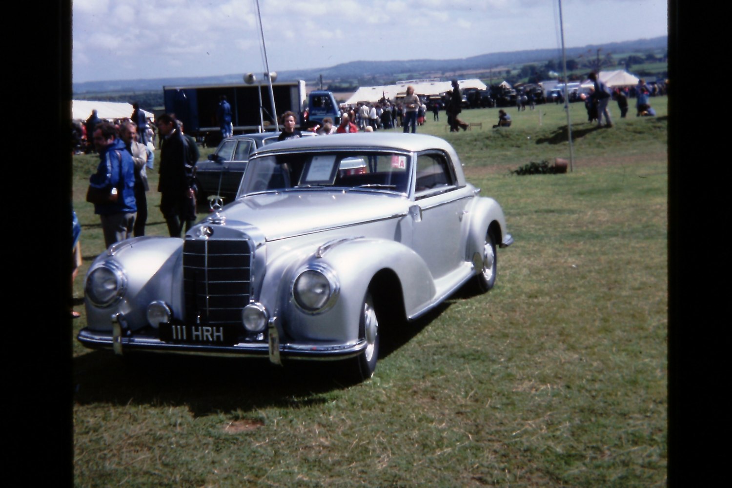 Classic vintage coupe with chrome grille and round headlights