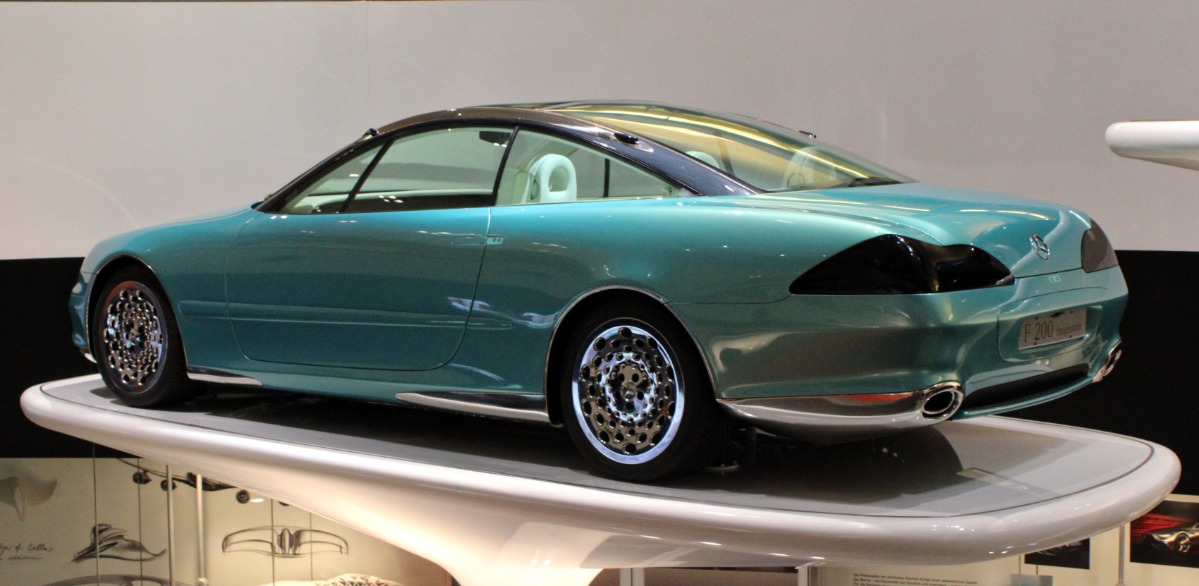 Futuristic coupe with tinted rear lights and distinctive alloy wheels