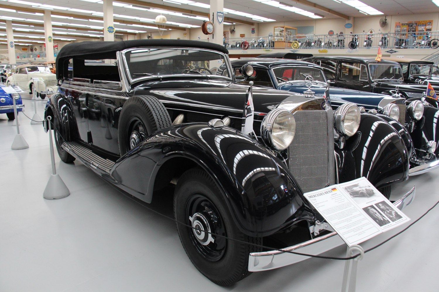 Classic luxury convertible with large round headlights and prominent front grille