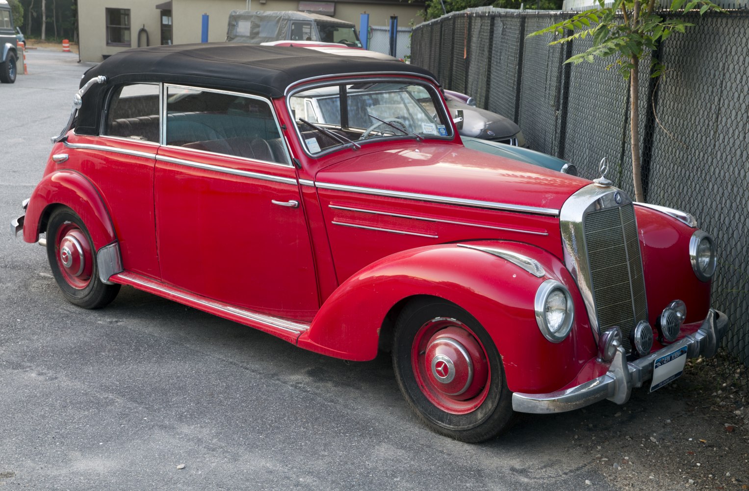 Vintage convertible with chrome grille and rounded fenders