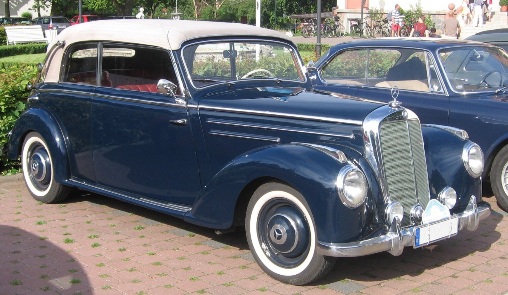 Vintage cabriolet with whitewall tires and chrome front grille