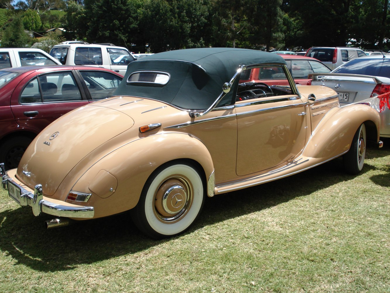 Vintage convertible with fabric soft top and whitewall tires