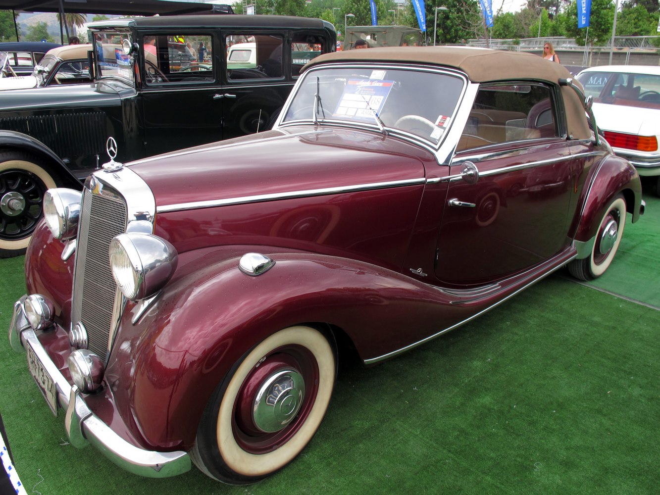 Classic convertible with chrome grille and wide whitewall tires