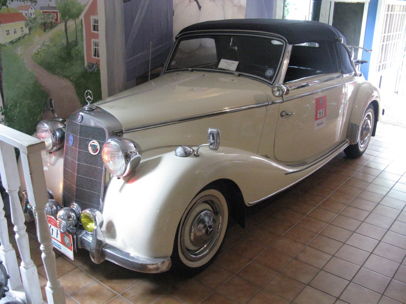 Classic vintage convertible with soft top and rounded fenders