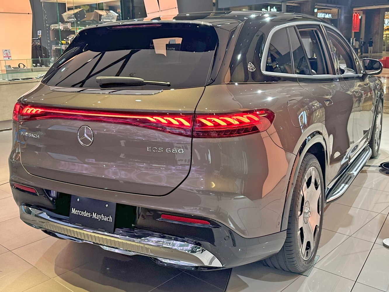 Rear view of luxury electric SUV with distinctive LED taillights and Maybach badging