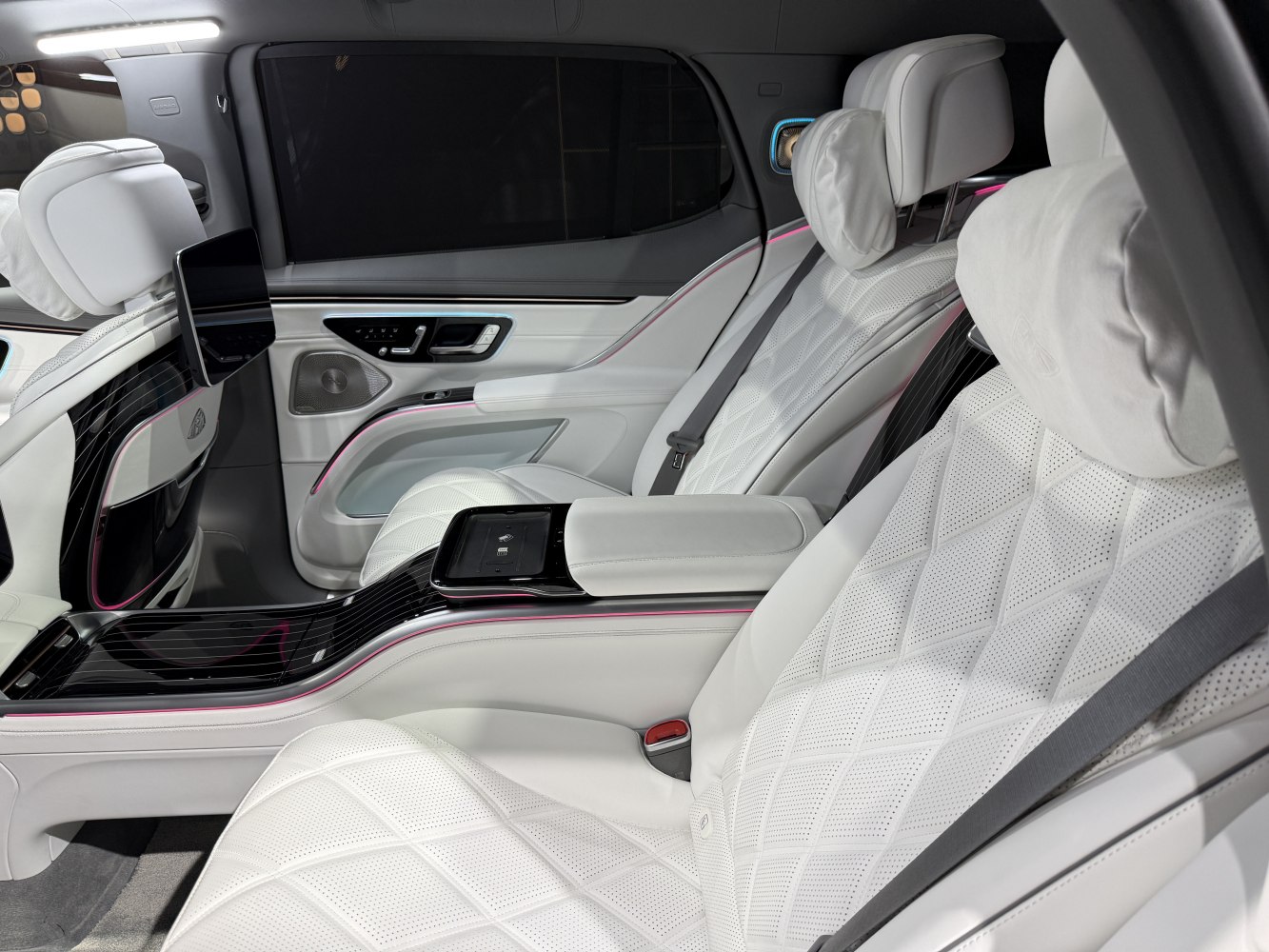 White quilted leather rear seats with ambient lighting and central armrest